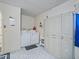 Functional laundry room with washer, dryer, and ample storage cabinets at 3266 Woodridge Dr, The Villages, FL 32162