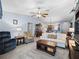 Inviting living room featuring an open layout that flows seamlessly to the dining and kitchen areas at 3266 Woodridge Dr, The Villages, FL 32162