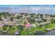 Panoramic aerial perspective featuring waterfront houses, serene lake, and lush greenery, capturing lakeside charm at 33620 Picciola Dr, Fruitland Park, FL 34731