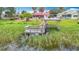 Aerial view showcasing a home with boat lift access to the lake offering peaceful waterfront living with direct recreational opportunities at 33620 Picciola Dr, Fruitland Park, FL 34731