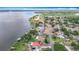Beautiful aerial view of lakefront properties, docks, and serene waters, illustrating the idyllic lakeside setting at 33620 Picciola Dr, Fruitland Park, FL 34731