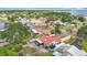 Aerial view of waterfront neighborhood on a lake with boat lifts, showcasing its attractive homes and recreational water access at 33620 Picciola Dr, Fruitland Park, FL 34731