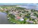 Stunning aerial view of the lakeside community, with houses, docks, and the expansive lake providing a serene backdrop at 33620 Picciola Dr, Fruitland Park, FL 34731
