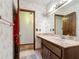 Bathroom featuring a long countertop, large mirror, and separate shower space at 33620 Picciola Dr, Fruitland Park, FL 34731