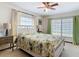 Comfortable bedroom showcasing a decorative white bed frame, curtains, and side tables at 33620 Picciola Dr, Fruitland Park, FL 34731