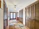 View of the entry hall with hardwood floors and multiple closet doors at 33620 Picciola Dr, Fruitland Park, FL 34731