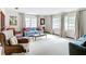 Bright living room with large windows and comfortable seating at 33620 Picciola Dr, Fruitland Park, FL 34731