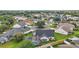 Aerial view of a home featuring a screened-in pool and mature landscaping at 342 Mccormick Ln, The Villages, FL 32162