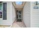 Inviting front entrance with brick paver walkway, sidelight, and transom window providing natural light at 342 Mccormick Ln, The Villages, FL 32162