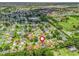 Neighborhood aerial view showcasing the property's location, surrounding homes, and community features, marked by a red pin at 3534 Auburndale Ave, The Villages, FL 32162