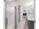 Bathroom featuring a modern sink vanity and a glass-enclosed shower at 3534 Auburndale Ave, The Villages, FL 32162