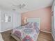 Comfortable bedroom featuring a decorative bed, a closet, and neutral walls at 3534 Auburndale Ave, The Villages, FL 32162