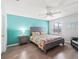 A well-lit bedroom featuring hardwood flooring and a ceiling fan at 3534 Auburndale Ave, The Villages, FL 32162