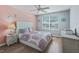 Cozy bedroom featuring a decorative bed, a window with blinds, and light wood floors at 3534 Auburndale Ave, The Villages, FL 32162