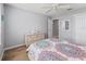 Bedroom featuring a decorative bed, a dresser, a closet, and neutral walls at 3534 Auburndale Ave, The Villages, FL 32162