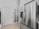 Stainless steel refrigerator in updated kitchen at 3534 Auburndale Ave, The Villages, FL 32162