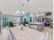 Open concept living, dining and kitchen featuring tile floors and views of the entrance at 3534 Auburndale Ave, The Villages, FL 32162