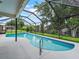 Inviting screened-in pool with outdoor seating and a peaceful backyard setting at 3534 Auburndale Ave, The Villages, FL 32162