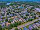 An aerial community view shows a home located on a tree-lined street in a well-maintained neighborhood at 3775 Brantley Place Cir, Apopka, FL 32703