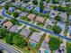 An aerial view shows a home with a pool and a yard surrounded by mature landscaping at 3775 Brantley Place Cir, Apopka, FL 32703