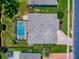 A beautiful home features a screened-in pool and well-maintained landscaping in this aerial view at 3775 Brantley Place Cir, Apopka, FL 32703