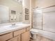 Bright bathroom featuring a shower and tub combo, and a well-lit vanity with light wood cabinets at 3775 Brantley Place Cir, Apopka, FL 32703