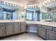 Elegant bathroom features dual sinks, generous counter space, and vanity area at 3775 Brantley Place Cir, Apopka, FL 32703