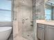 Luxurious bathroom with glass enclosed shower, soaking tub, and elegant vanity at 3775 Brantley Place Cir, Apopka, FL 32703