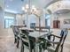 Open dining room with dark wood table and seating for eight, perfect for gatherings at 3775 Brantley Place Cir, Apopka, FL 32703