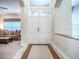 Bright foyer featuring double doors, neutral tones, and a view into the inviting living area at 3775 Brantley Place Cir, Apopka, FL 32703