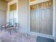 Inviting front porch with seating and elegant double doors, perfect for relaxing at 3775 Brantley Place Cir, Apopka, FL 32703