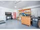 Garage with epoxy flooring, ample storage cabinets, red tool chest and workbench at 3775 Brantley Place Cir, Apopka, FL 32703