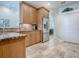 Spacious kitchen boasts stainless steel appliances, granite countertops, and tile flooring at 3775 Brantley Place Cir, Apopka, FL 32703