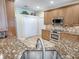 Kitchen featuring granite countertops, stainless steel appliances, and custom wood cabinetry at 3775 Brantley Place Cir, Apopka, FL 32703