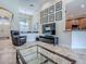 Living room with tile floors, high ceilings, and open access to other areas of the home at 3775 Brantley Place Cir, Apopka, FL 32703
