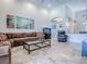 Bright living room with tile floors and large sectional sofa at 3775 Brantley Place Cir, Apopka, FL 32703