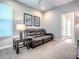 Living room featuring a sofa, end table, and carpeted floor at 3775 Brantley Place Cir, Apopka, FL 32703