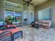 Covered patio featuring brick flooring and comfortable seating overlooking pool at 3775 Brantley Place Cir, Apopka, FL 32703