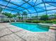 Relaxing screened-in pool with a spa and comfortable lounge chairs at 3775 Brantley Place Cir, Apopka, FL 32703