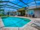 View of the screened-in pool, patio, and backyard landscaping showcasing outdoor living at 3775 Brantley Place Cir, Apopka, FL 32703