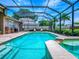 Inviting screened-in pool with attached spa, perfect for relaxation and outdoor entertaining at 3775 Brantley Place Cir, Apopka, FL 32703