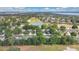 Features a residential neighborhood with a pond, golf course, and lush tree coverage at 3842 Beacon Ridge Way, Clermont, FL 34711