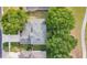 Overhead shot of a home's roof amidst lush greenery and trees at 3842 Beacon Ridge Way, Clermont, FL 34711