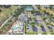 Features a clubhouse pool, tennis courts, parking, and landscaped green spaces at 3842 Beacon Ridge Way, Clermont, FL 34711