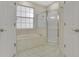 Bright bathroom with soaking tub and walk-in shower at 3842 Beacon Ridge Way, Clermont, FL 34711