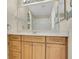 Bathroom vanity with ample storage and an oversized mirror at 3842 Beacon Ridge Way, Clermont, FL 34711