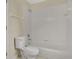 Clean bathroom featuring a toilet next to the tiled tub and shower at 3842 Beacon Ridge Way, Clermont, FL 34711