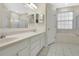 Bright bathroom with double vanity and separate soaking tub at 3842 Beacon Ridge Way, Clermont, FL 34711