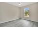 Bright bedroom with light gray wood floors and a ceiling fan for comfort at 3842 Beacon Ridge Way, Clermont, FL 34711