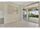 Bright dining area featuring tile flooring, sliding glass doors, and an open layout at 3842 Beacon Ridge Way, Clermont, FL 34711